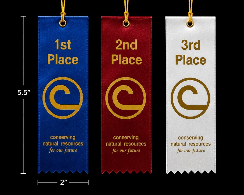 Product Description: Award Ribbons</br></br>Recognize outstanding achievement with NACD's premium satin award ribbons. Each ribbon is crafted from high quality satin with gold foil imprinting and features the NACD Conservation C logo and the message "Conserving Natural Resources for Our Future." A gold cord is attached for easy display and presentation.</br></br>Ribbons measure 2 inches wide by 5.5 inches long (excluding the hanging cord) and are ideal for local, state, and national conservation education contests, youth events, and award ceremonies.</br></br>Available Options</br></br>1st Place Ribbon $2.50</br>Royal blue satin ribbon with gold foil imprint featuring the NACD Conservation C logo, "1st Place," and the conservation message.</br></br>2nd Place Ribbon $2.50</br>Deep red satin ribbon with gold foil imprint featuring the NACD Conservation C logo, "2nd Place," and the conservation message.</br></br>3rd Place Ribbon $2.50</br>White satin ribbon with gold foil imprint featuring the NACD Conservation C logo, "3rd Place," and the conservation message.</br></br>Honorable Mention Ribbon $2.50</br>Green satin ribbon with gold foil imprint featuring the NACD Conservation C logo, "Honorable Mention," and the conservation message. A meaningful way to recognize outstanding entries deserving of special recognition.</br></br>Champion Rosette Ribbon $7.50</br>A premium purple satin rosette with a pleated center featuring the NACD Conservation C logo and two flowing ribbon streamers. One streamer is imprinted with "Champion," while the other displays the conservation message "Conserving Natural Resources for Our Future." This top recognition ribbon is ideal for overall winners, grand champions, and Best of Show awards.</br></br>All ribbons are designed exclusively for NACD and coordinate as a complete award set for conservation education contests and recognition programs.</br> Conservation Award Ribbons